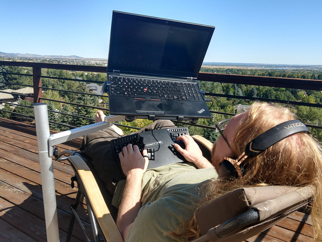 view of laptop screen while reclining in the sun