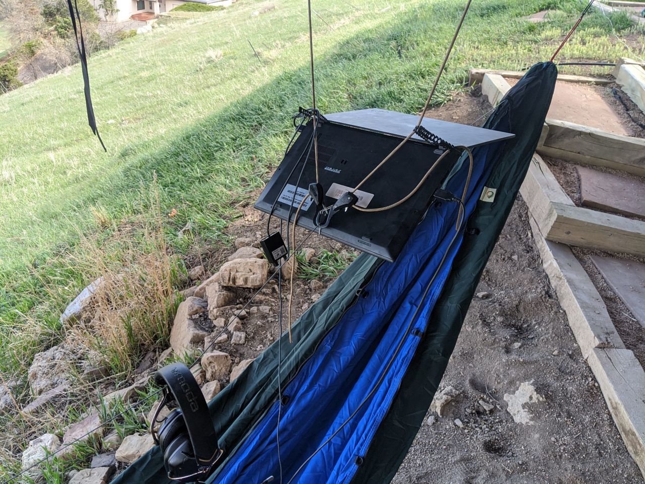 photo of hammock with laptop suspended above