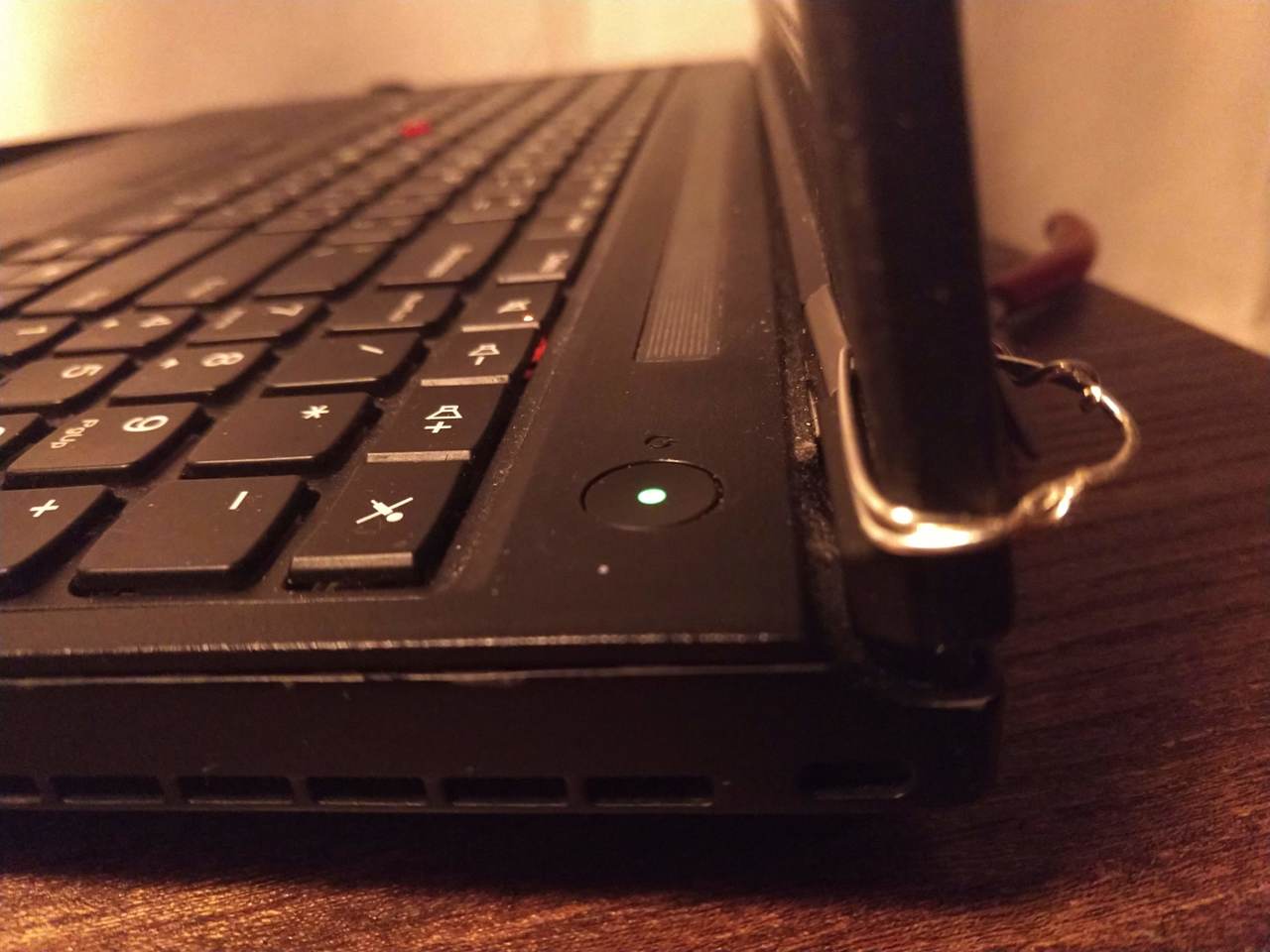 wire sloppily put around ThinkPad hinge